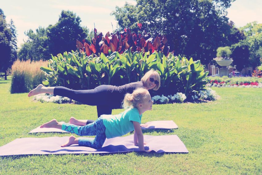 Mother and daughter bonding through yoga.