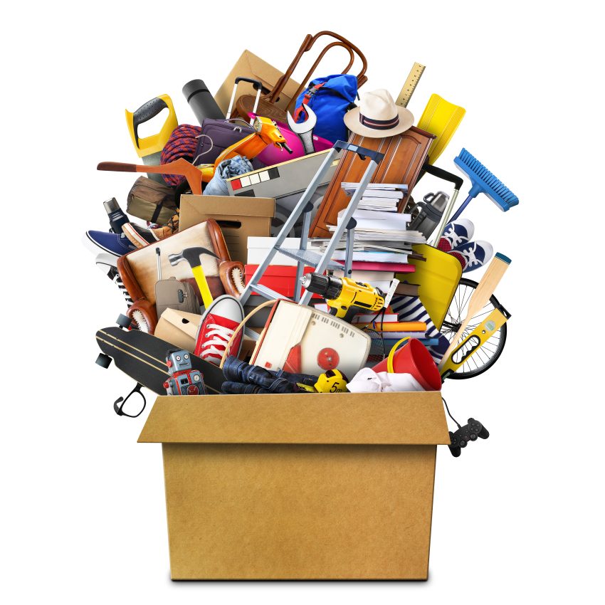 Large pile of household items stacked in a box